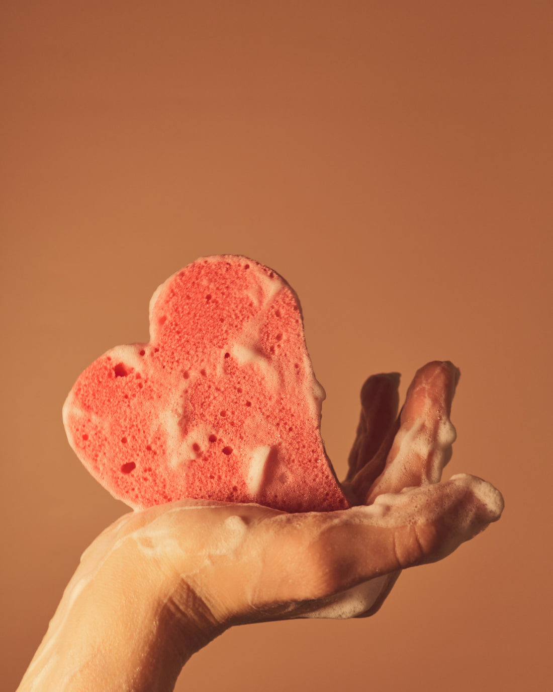 soft heart-shaped sponge and soap 