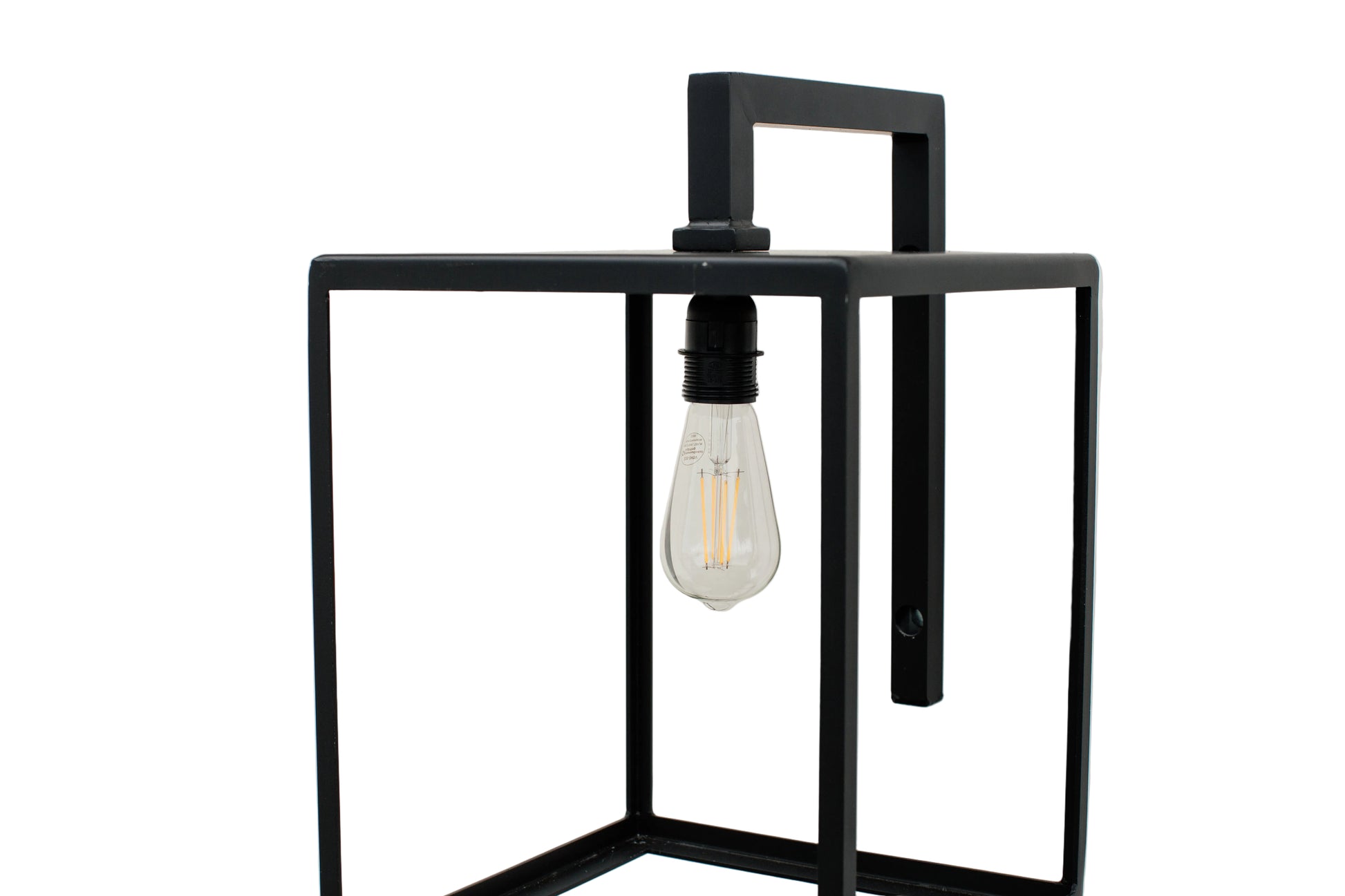 Black metal wall sconce with a lit light bulb on a white background